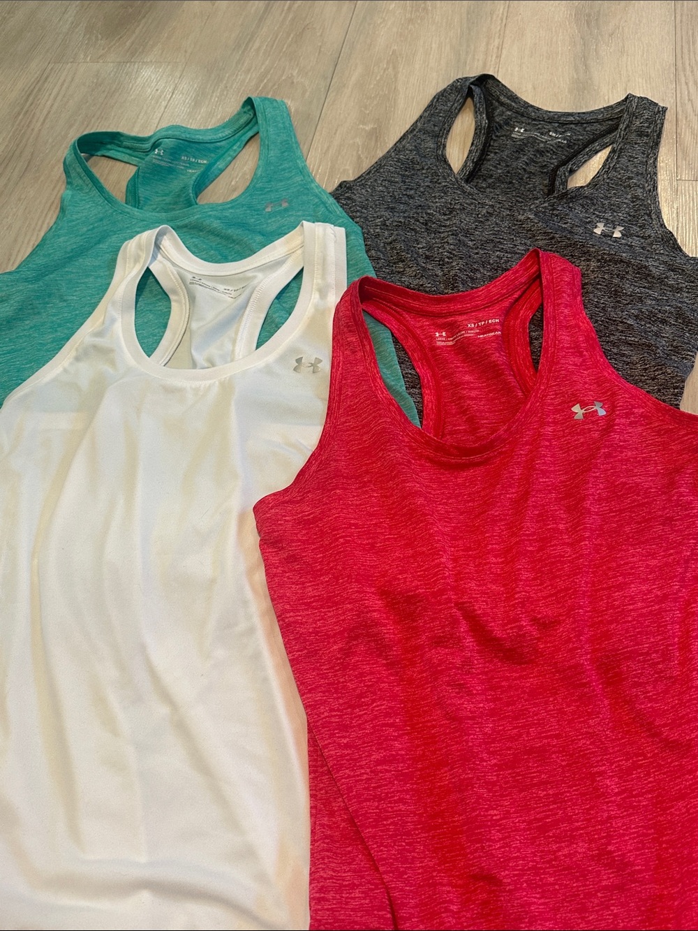 Lot of 4!!! Under Armour Women’s Racerback Tank Tops hot pink ,White, Teal, Gray